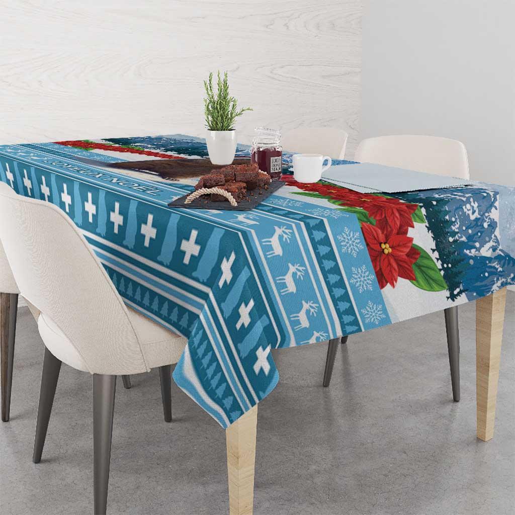 Blue Christmas tablecloth with geometric stripes and poinsettia accents