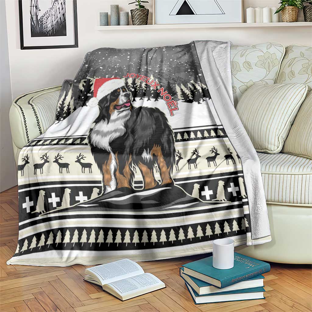 Folded on couch Christmas blanket featuring Bernese mountain dog and Joyeux Noel lettering