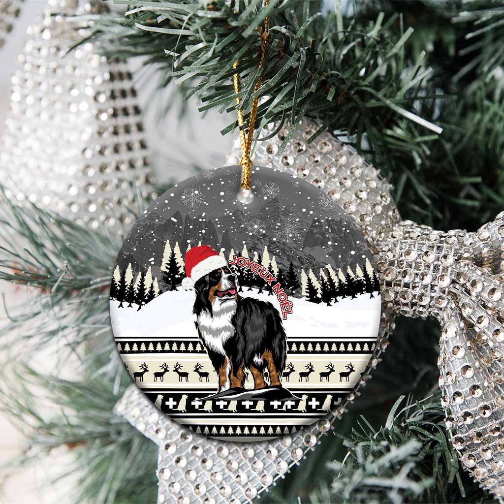 Ceramic round ornament close-up with Bernese mountain dog and snowy trees, gold hanging loop
