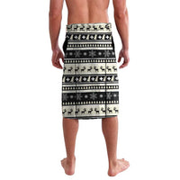Beige and black holiday striped board shorts with dog and tree motifs