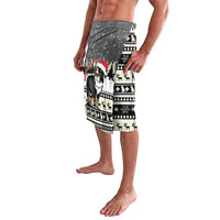 Beige and black holiday dog patterned board shorts with elastic waistband