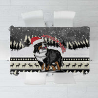 Christmas Bernese Mountain Dog tablecloth with red “Joyeux Noel” and snowy pine scene