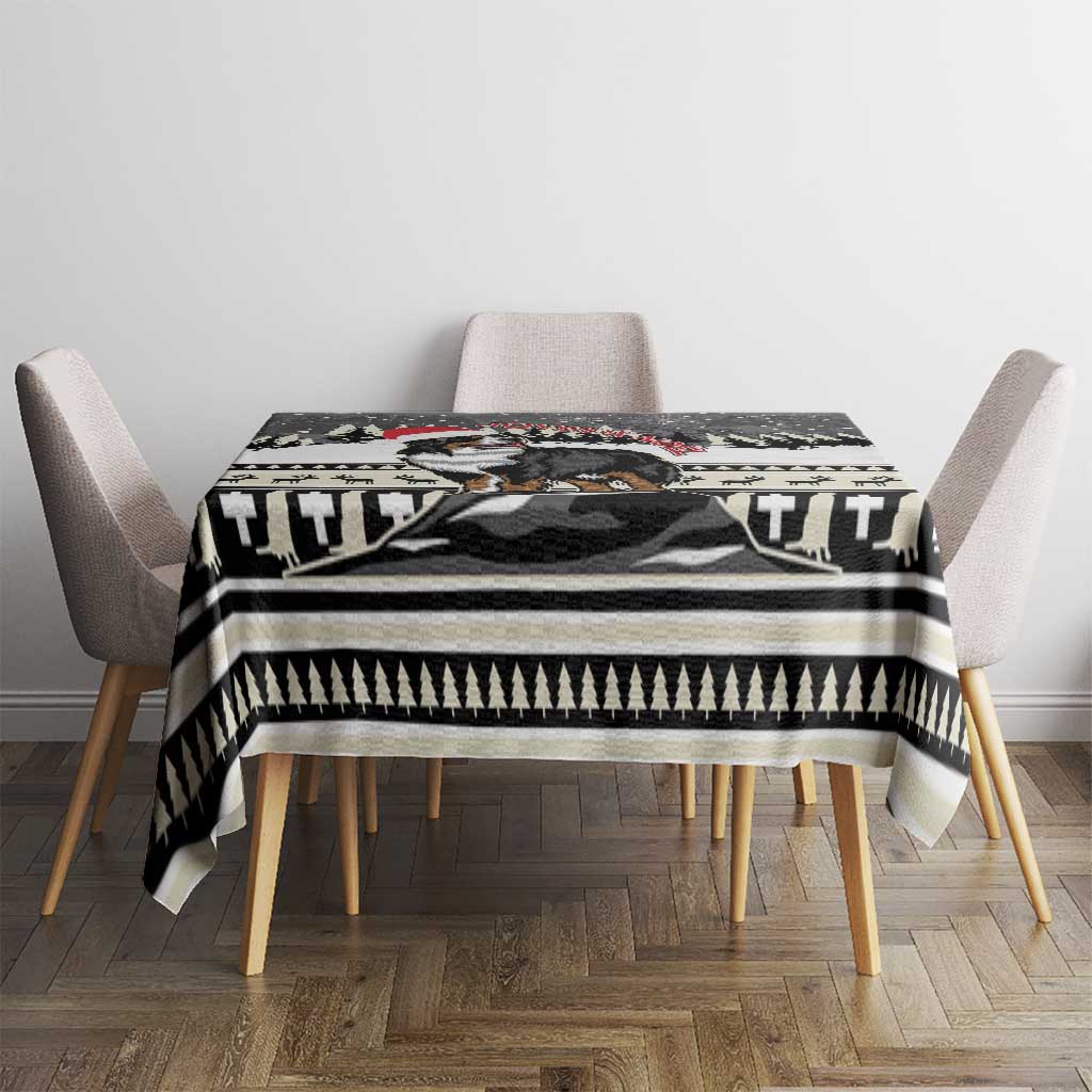 Christmas Bernese Mountain Dog tablecloth draped over a dining table with black-and-white border