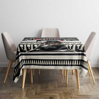 Christmas Bernese Mountain Dog tablecloth draped over a dining table with black-and-white border