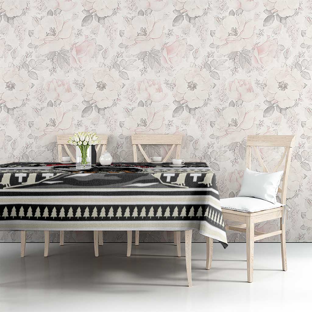 Black-and-white Christmas tablecloth with evergreen stripes and dog-themed center scene