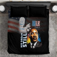 Black bedding set with two dark pillows and MLK Day themed portrait graphic