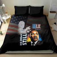 Black bedding set with two dark pillows, MLK Day text and portrait print