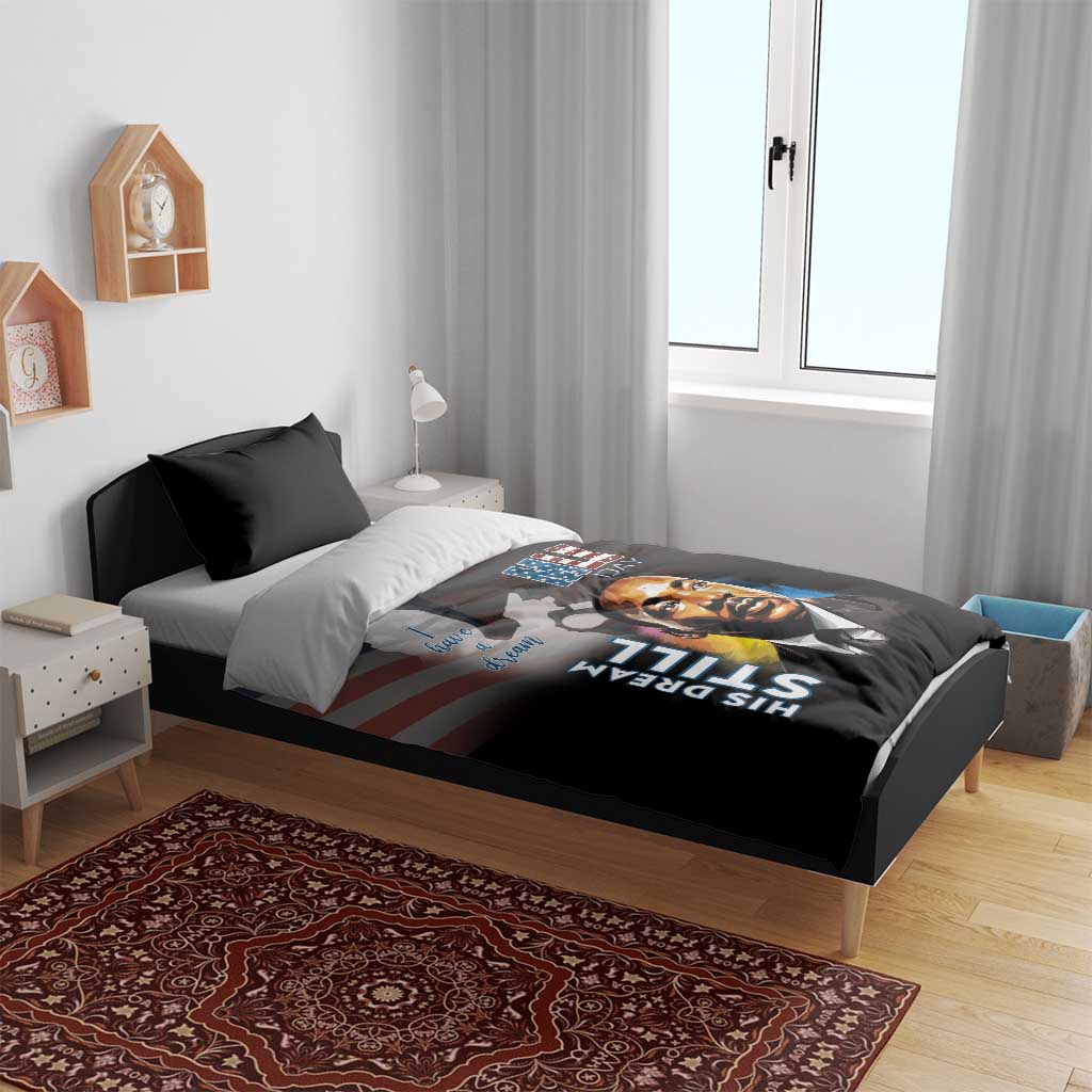 Black bedding set with dark pillows and MLK Day portrait print on duvet