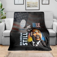 Black MLK Day throw blanket on gray couch with Martin Luther King Jr. portrait