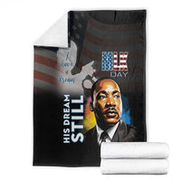 Black MLK Day blanket folded with Martin Luther King Jr. portrait and 'His Dream Still'