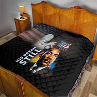 Black quilt on bed with quilted pattern, MLK Day portrait and stars-and-stripes