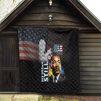 Black quilt hanging on porch wall with quilted texture, MLK Day portrait graphic