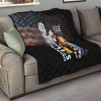 Black quilt draped on sofa with quilted design, MLK Day portrait and star flag