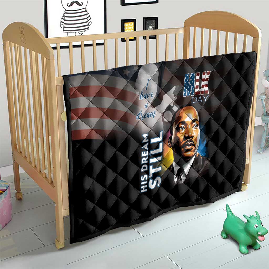 Black quilt on baby bed with quilted pattern, MLK Day portrait and stars-and-stripes