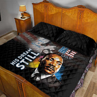 Black quilt bed set with quilted pillows; MLK portrait, 'His Dream Still' and star flag art.