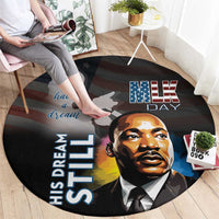 Round black MLK Day carpet with “MLK” star text, raised “His Dream Still…” lettering and face