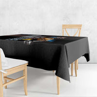 Black tablecloth with MLK Day portrait artwork and bold border-drape on table