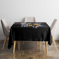 Black tablecloth featuring MLK Day portrait and colorful quote print across tabletop