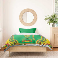 Green dashiki duvet set with Your Text ribbon and star motif on bed with two pillows