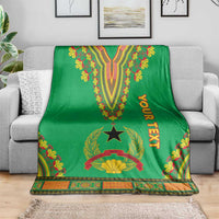 Green dashiki-pattern blanket on sofa with V design, star emblem, border trim and YOUR TEXT
