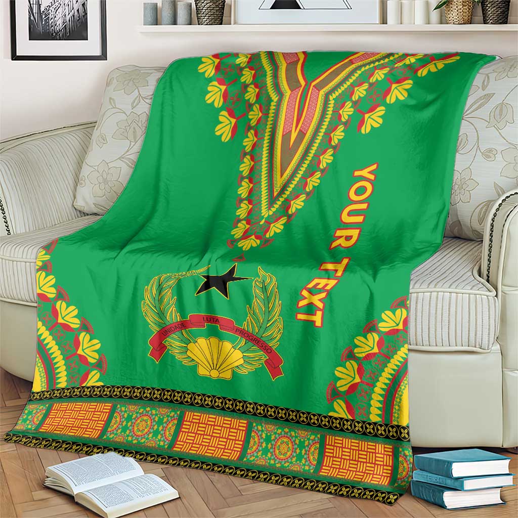 Green dashiki-pattern blanket on couch with V motif, star emblem, leaf edging and YOUR TEXT