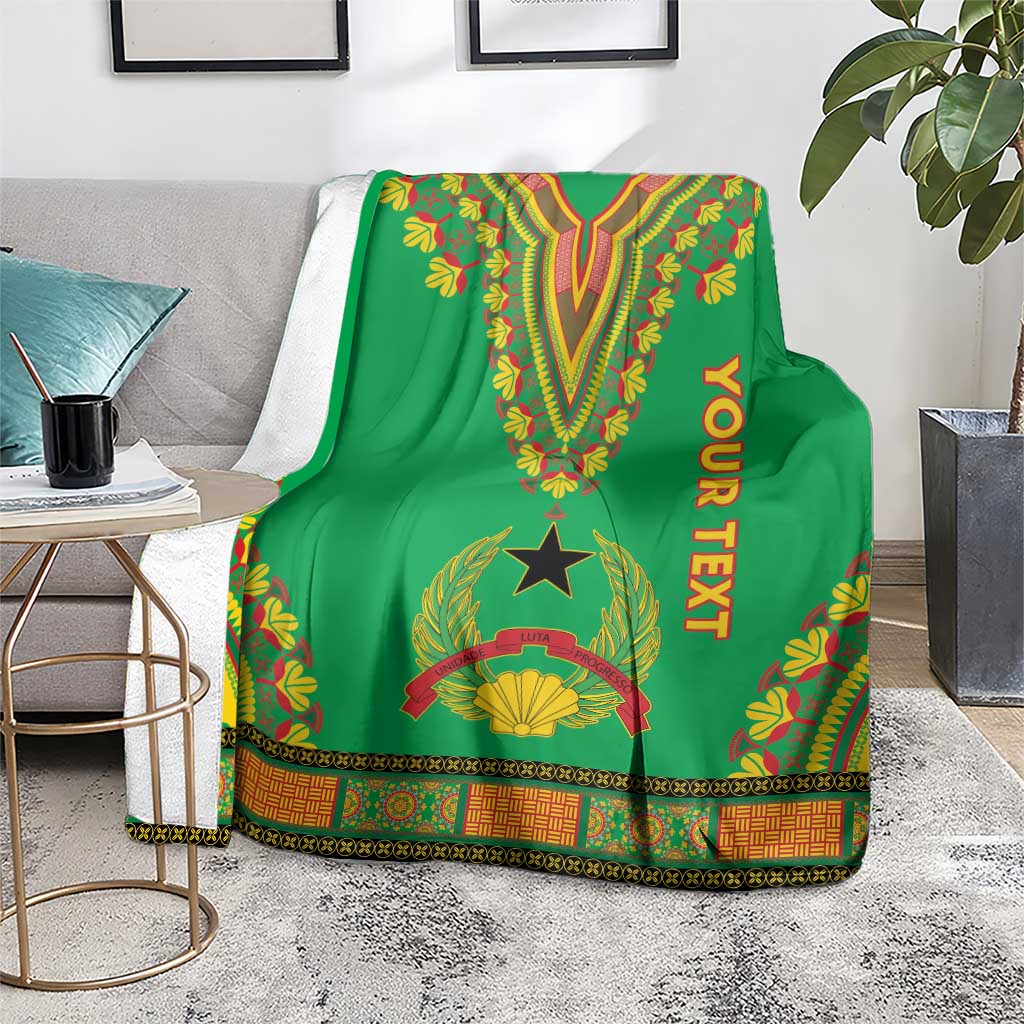 Green dashiki-pattern blanket on floor with V design, star emblem, border trim and YOUR TEXT