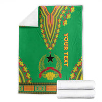Green dashiki-pattern blanket with V motif and star emblem; folded with border and YOUR TEXT