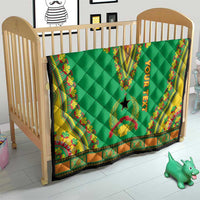 Green dashiki personalized quilt on a wooden crib, “YOUR TEXT” and star motif