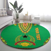 Round green dashiki-pattern carpet with central star crest and vertical "YOUR TEXT"