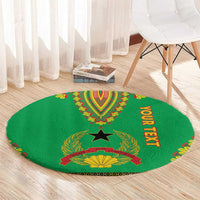 Round green dashiki-pattern carpet with center crest and vertical "YOUR TEXT" lettering