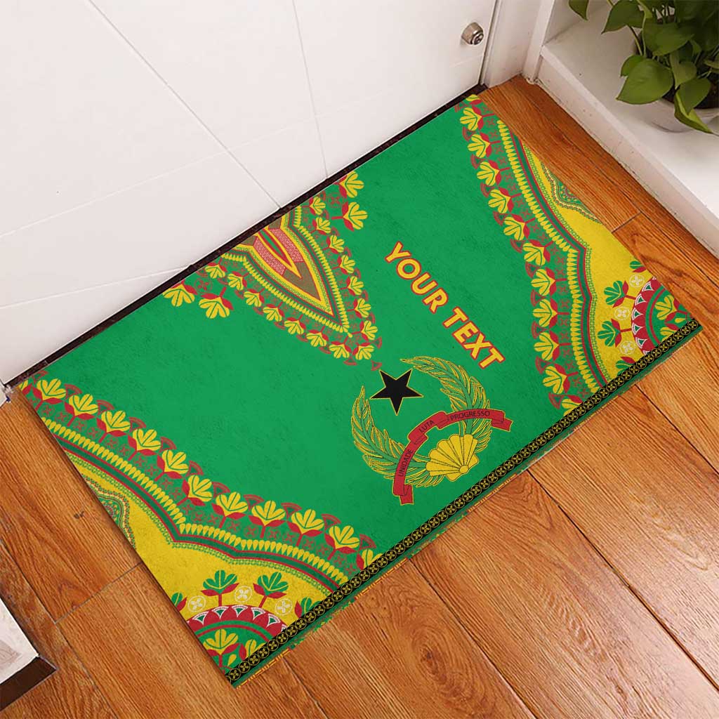 Green rubber doormat with Dashiki pattern border, central star, 'YOUR TEXT' in orange