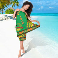 Green dashiki sarong with YOUTREX text and red-yellow floral trim