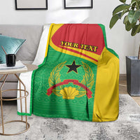 Green, yellow, and red personalized blanket with coat of arms, black star, and “YOUR TEXT”