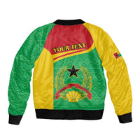 Green and yellow bomber jacket with red back, black cuffs, star and laurel crest