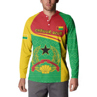 Button-collar sweatshirt with green, yellow, red panels and large coat-of-arms chest print