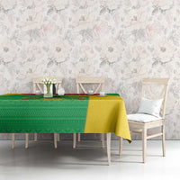 Personalised Guinea-Bissau tablecloth on white dining set, green panel with yellow center.