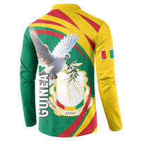 Back view green button sweatshirt with yellow shoulders, GUINEA text and pigeon graphic