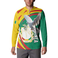 Green button sweatshirt on model with yellow collar, coat of arms and pigeon print