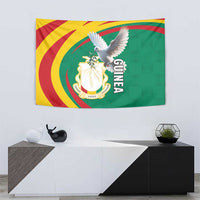 Guinea tapestry wall hanging with dove over coat of arms, green yellow red sunburst