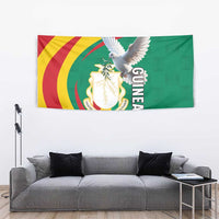 Guinea tapestry wall hanging with white dove and coat of arms emblem, green yellow red