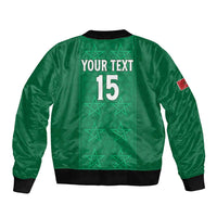 Green bomber jacket with back print 'YOUR TEXT 15', black rib trim, red sleeve patch.