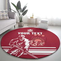 Red round hockey carpet with white “YOUR TEXT” and player graphic in living room