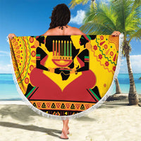 Round beach blanket with Happy Kwanzaa illustration, bold red yellow African motifs, white fringe
