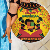Round beach blanket with Happy Kwanzaa print, yellow background and colorful figures, fringed edge
