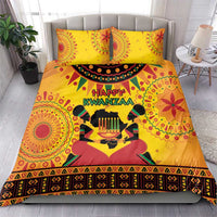 Orange African-pattern bedding set with two pillows and 'Happy Kwanzaa' print