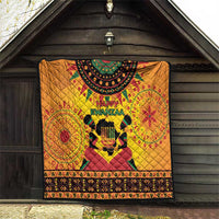 Orange Kwanzaa holiday quilt with Happy Kwanzaa text, drum figure, ornate border design