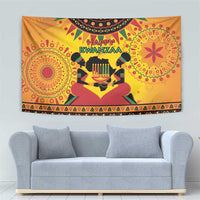 Orange Kwanzaa tapestry with 'Happy Kwanzaa' lettering and decorative border band