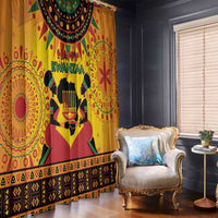 Orange curtain panels with “Happy Kwanzaa” text, candle graphic, and geometric border