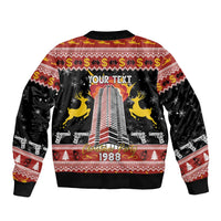 Unisex black bomber jacket with "YOUR TEXT" and 1988 festive skyline on back