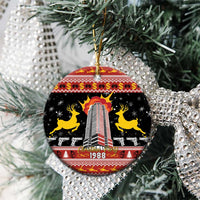 Black ceramic hanging ornament with gold loop, 1988 skyline tower and festive patterns